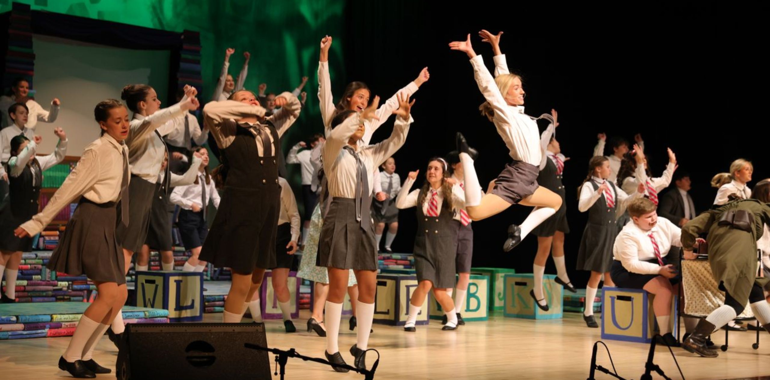 Students performing on stage during a school play