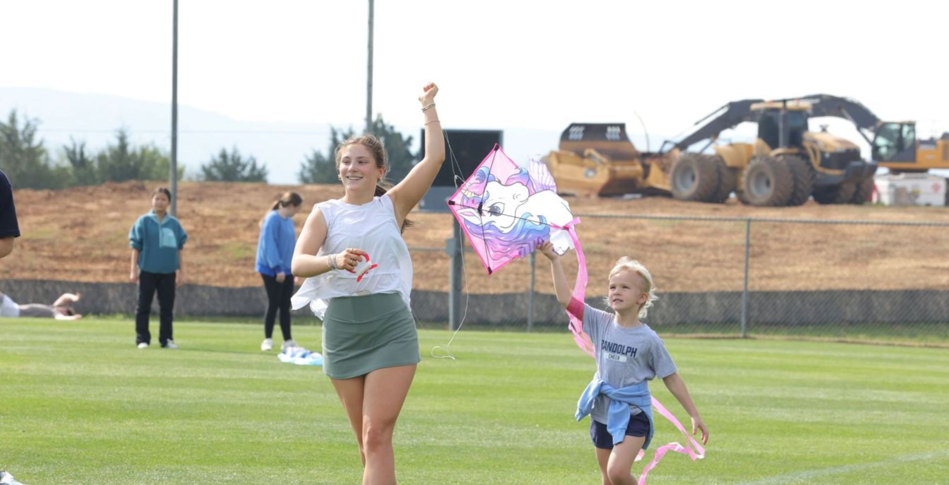Two students flying a kite