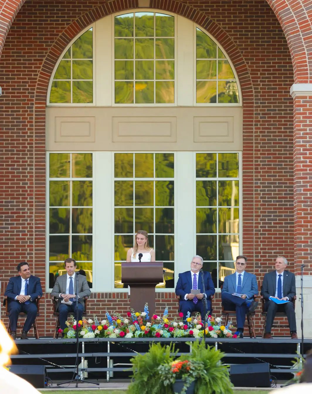 Student giving a speech at a school ceremony