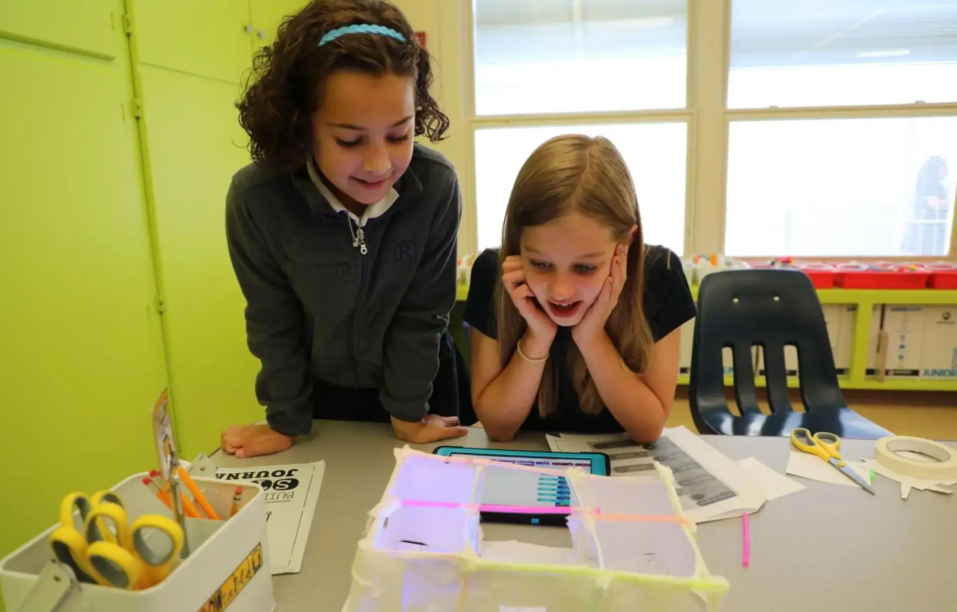Students with dyslexia support each other while reviewing schoolwork.