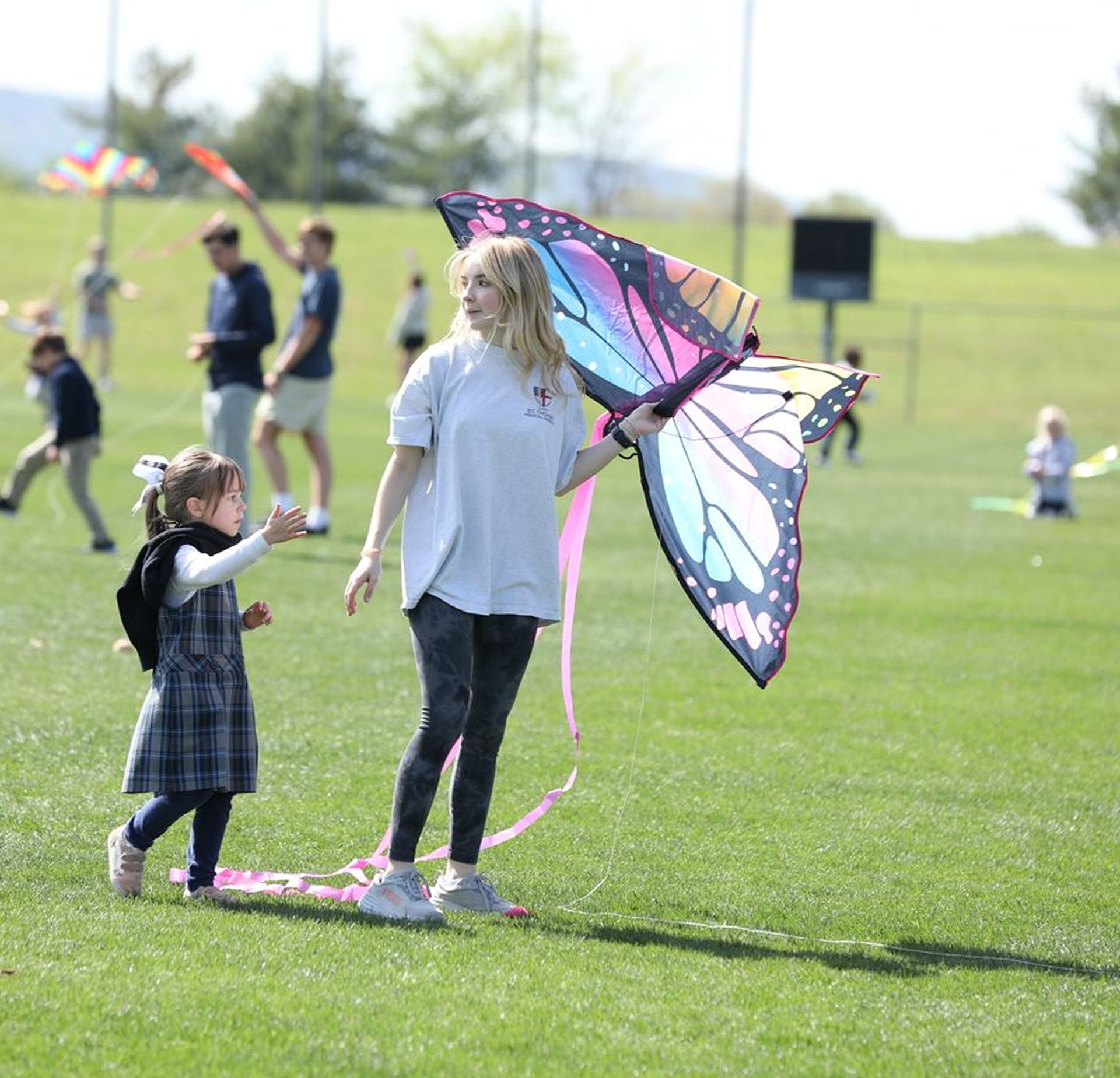 Students playing with a kite