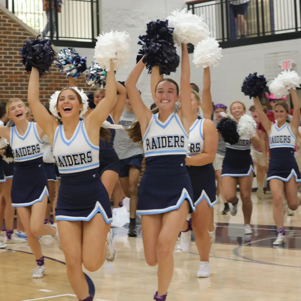 Upper school cheerleaders celebrate Raider spirit at a pep rally. 