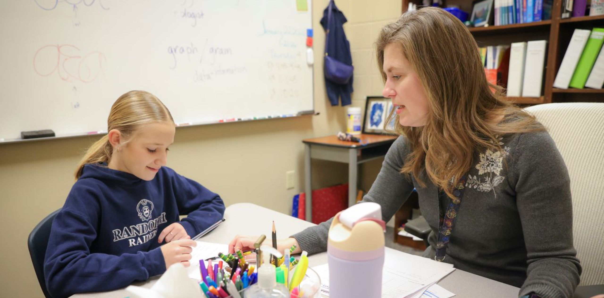 teacher tutoring student