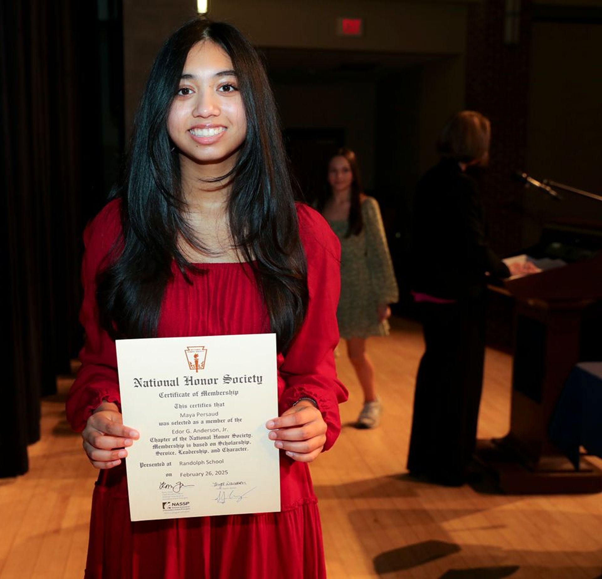 Proud student holding a certificate