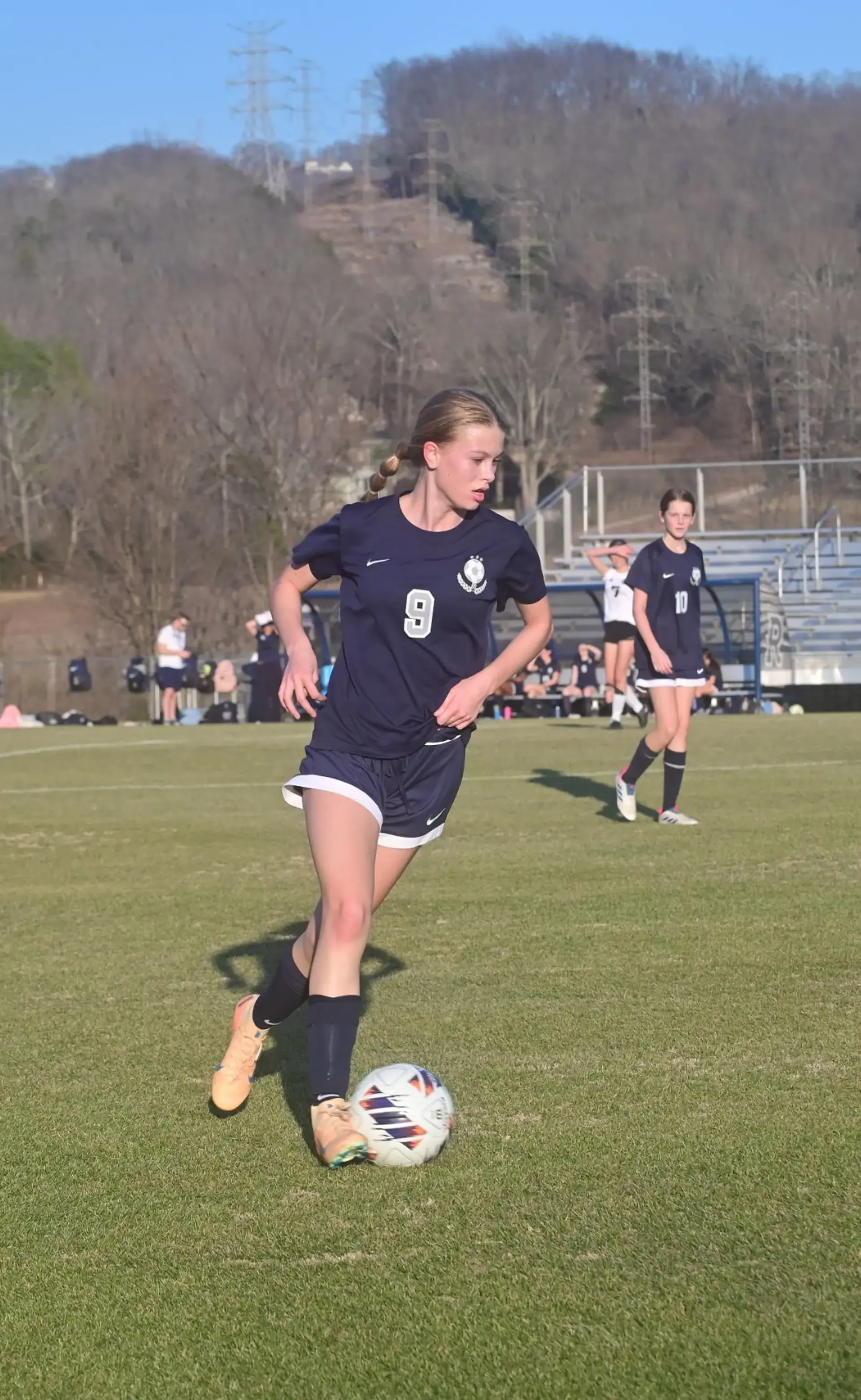Student playing soccer