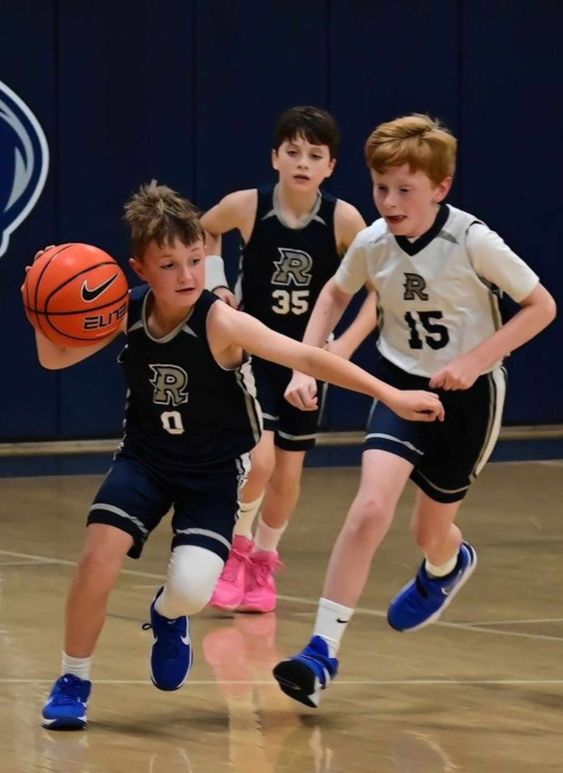 Boys students playing basketball