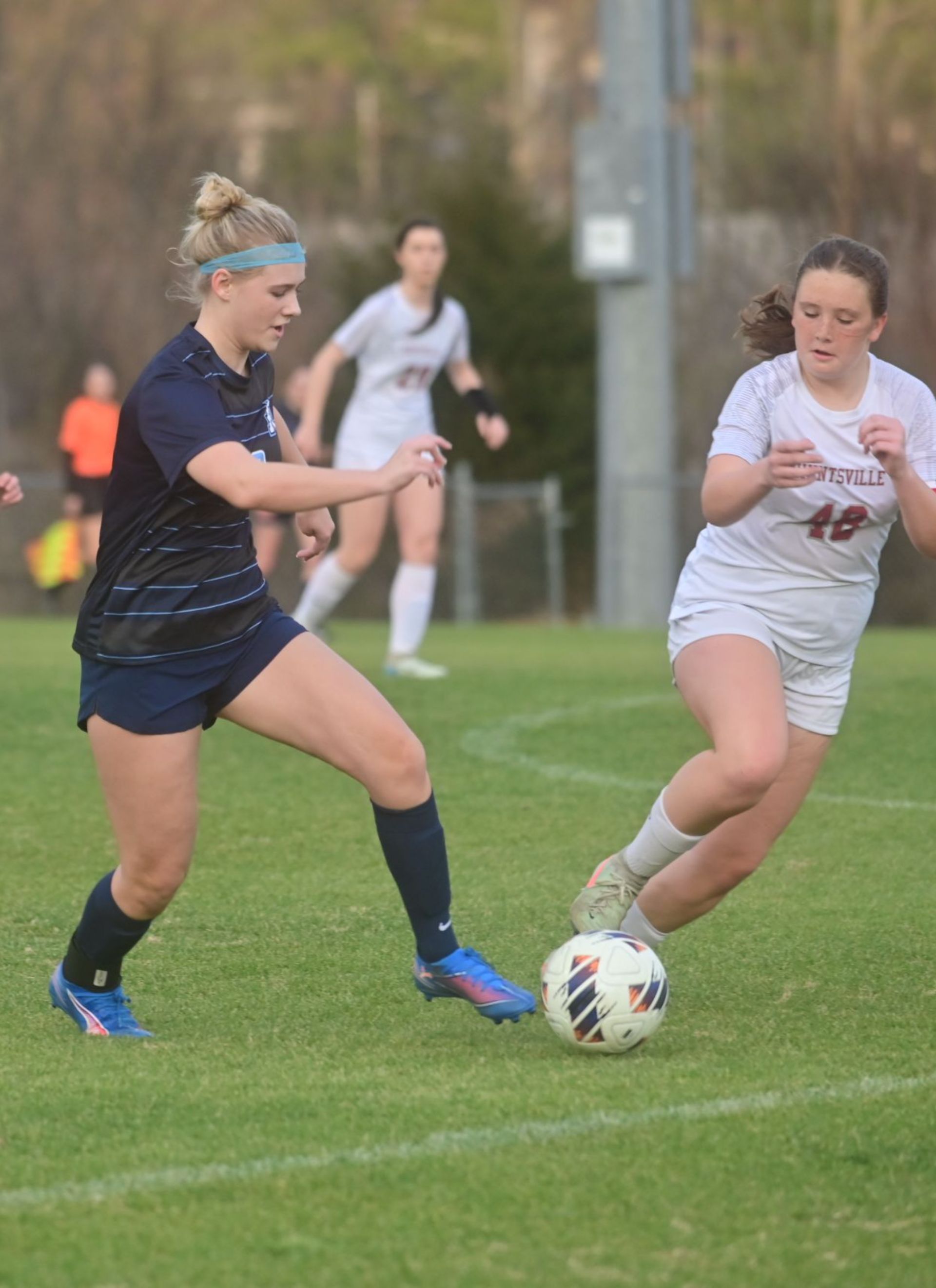 Female students playing soccer