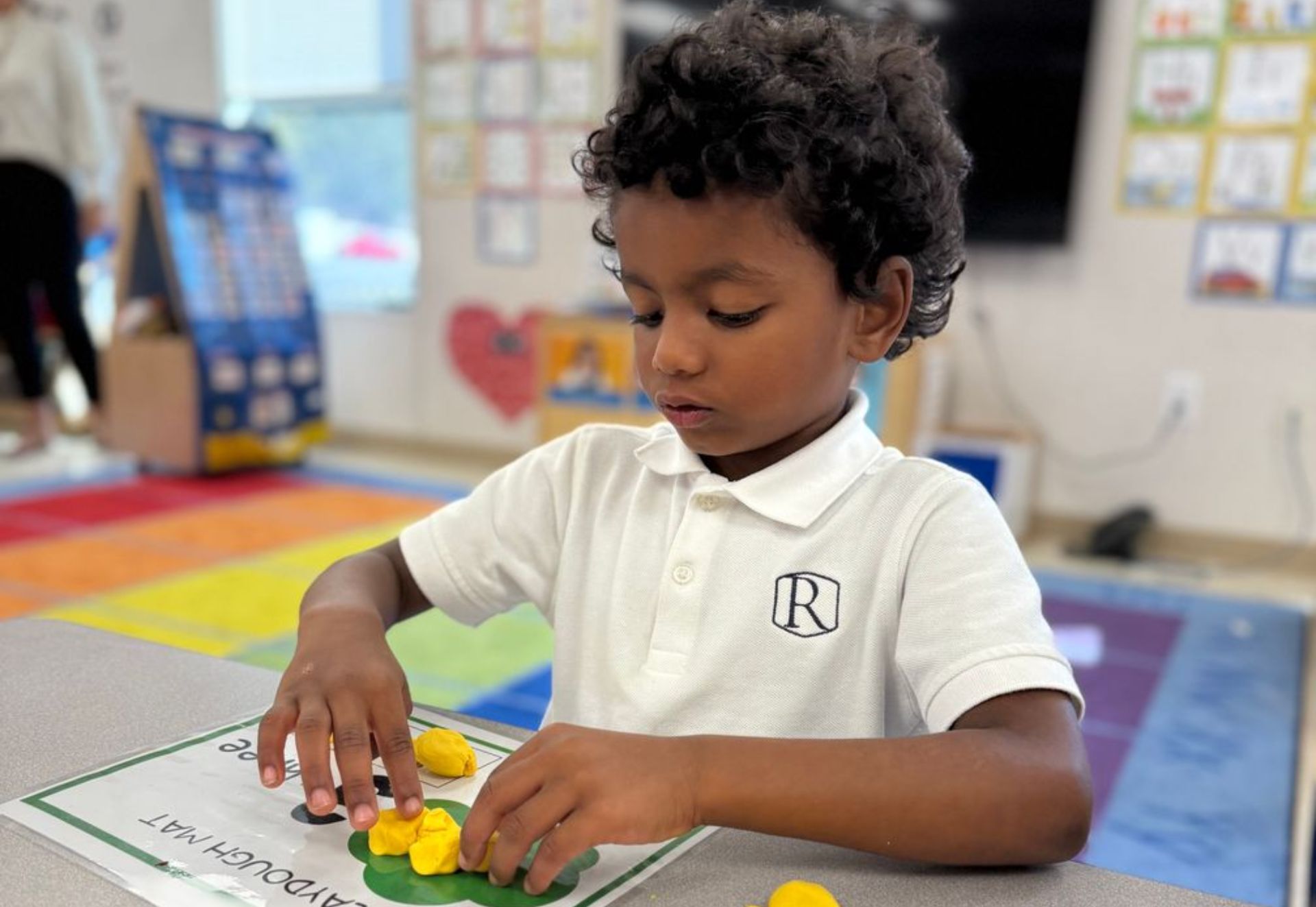 Lower school student engaging in a math activity