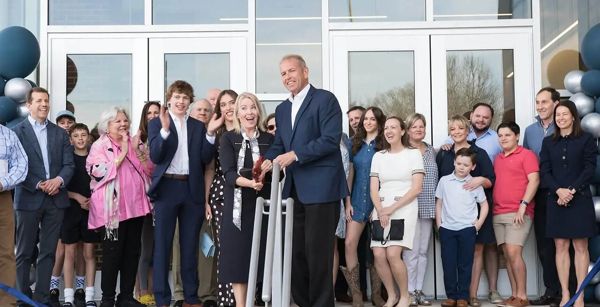 Picture of people posing at the opening of the Leo Centre for Excellence.