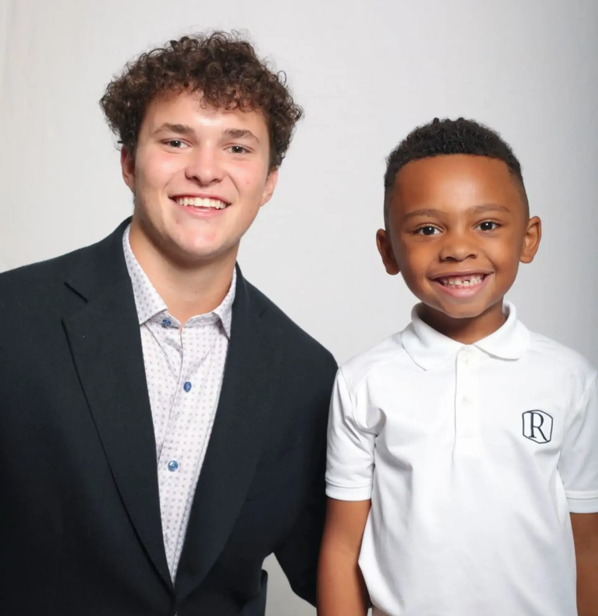 A Randolph senior with his kindergarten smile together at Opening Convocation. 
