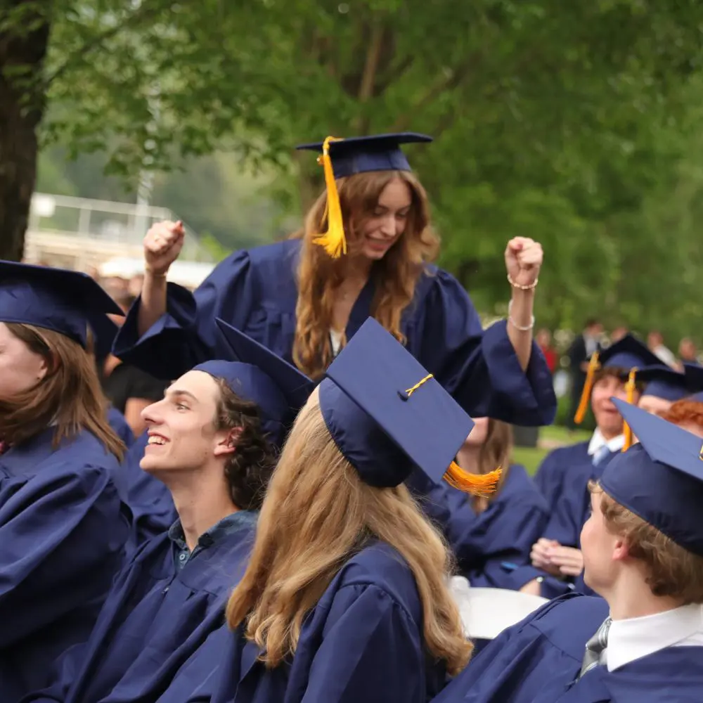Student celebrating at high school graduation. 