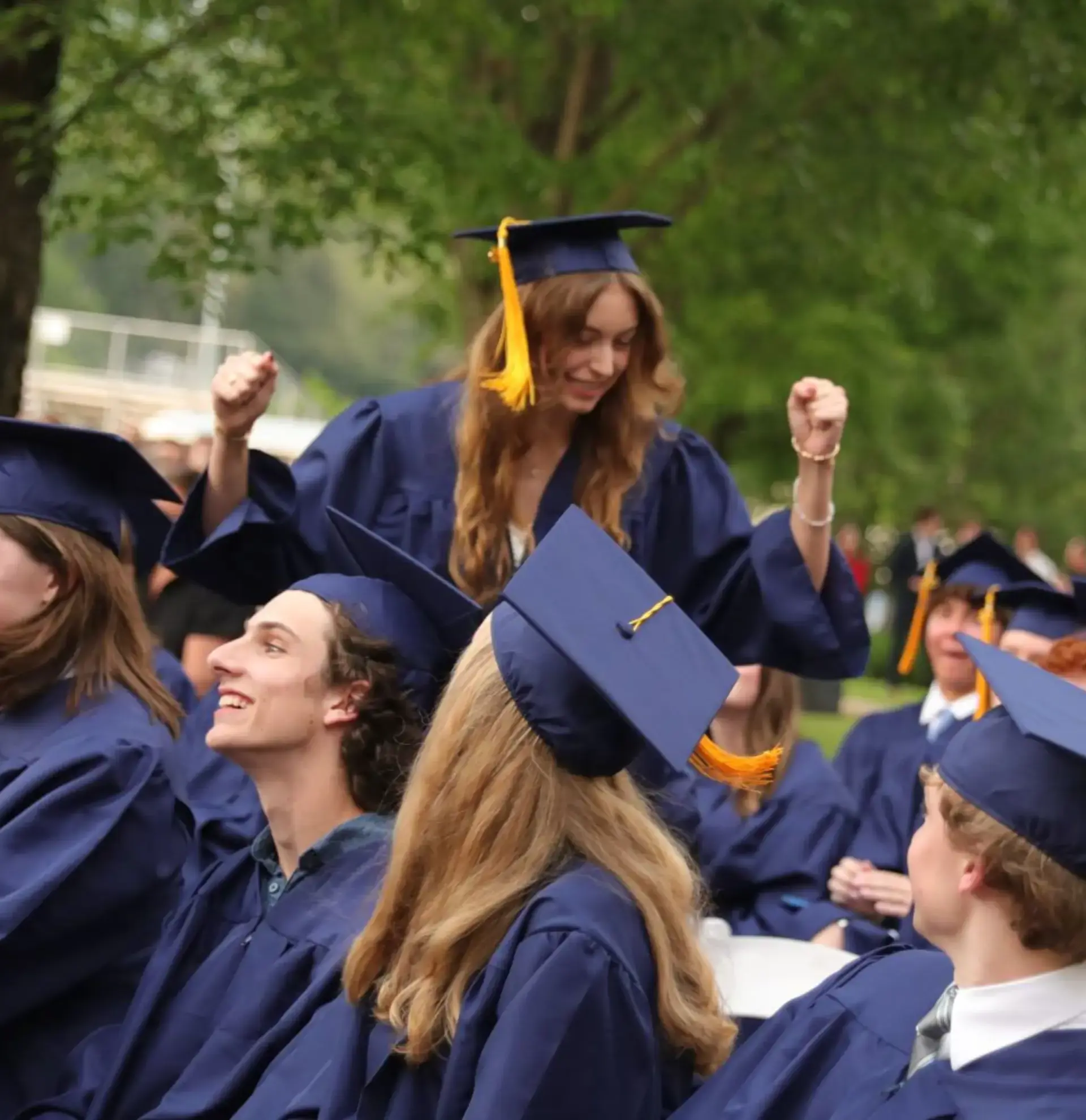 Upper School student celebrates at graduation. 